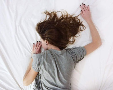 Woman sleeps on antibacterial sheets