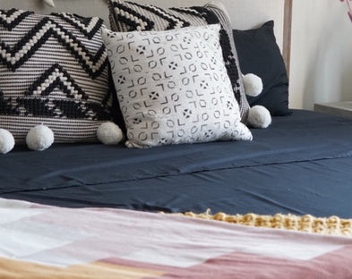 How to accentuate bold sheet choices, like black bed sheets